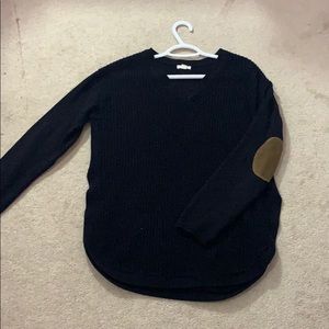Black knit sweater with brown patches